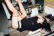 A woman laying on top of a counter with her legs up.